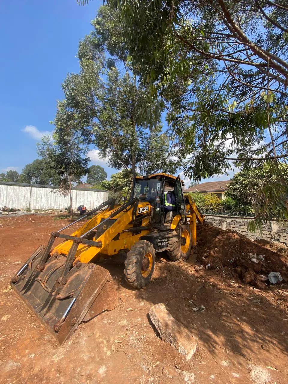 JCB backhoe loader positioned for practical training at the Georex training ground
