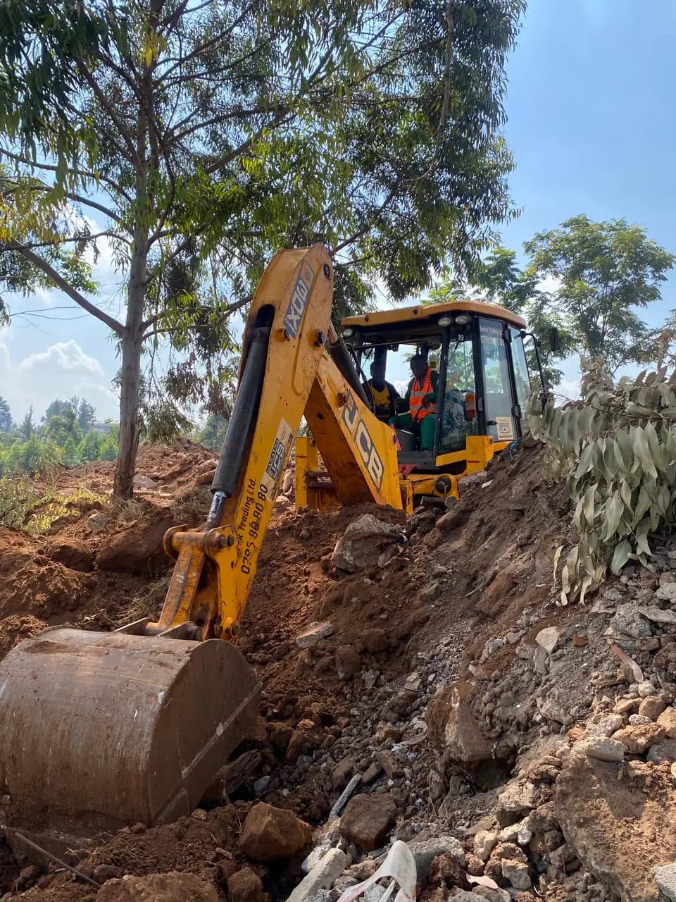 Georex trainees operating a backhoe during a trench excavation exercise